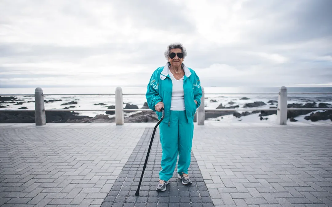 older woman with walking stick