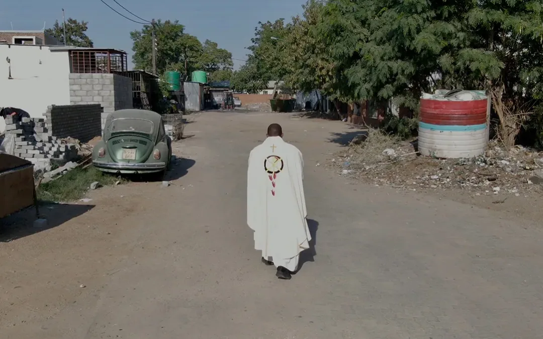 Pastor walking in the road